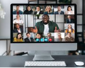 Diverse group of professionals on a video conference call shown on a desktop monitor